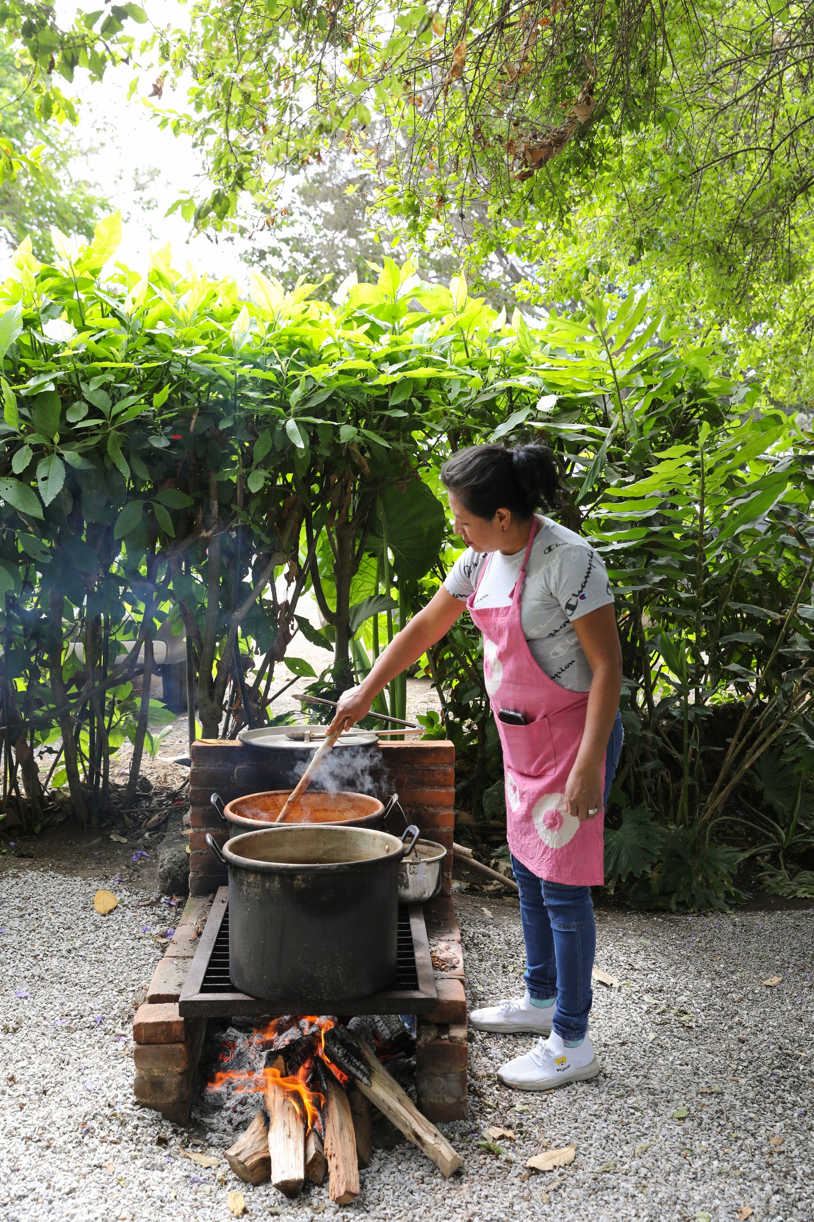 Images may contain cooking food stirring food children wear clothes and shoes